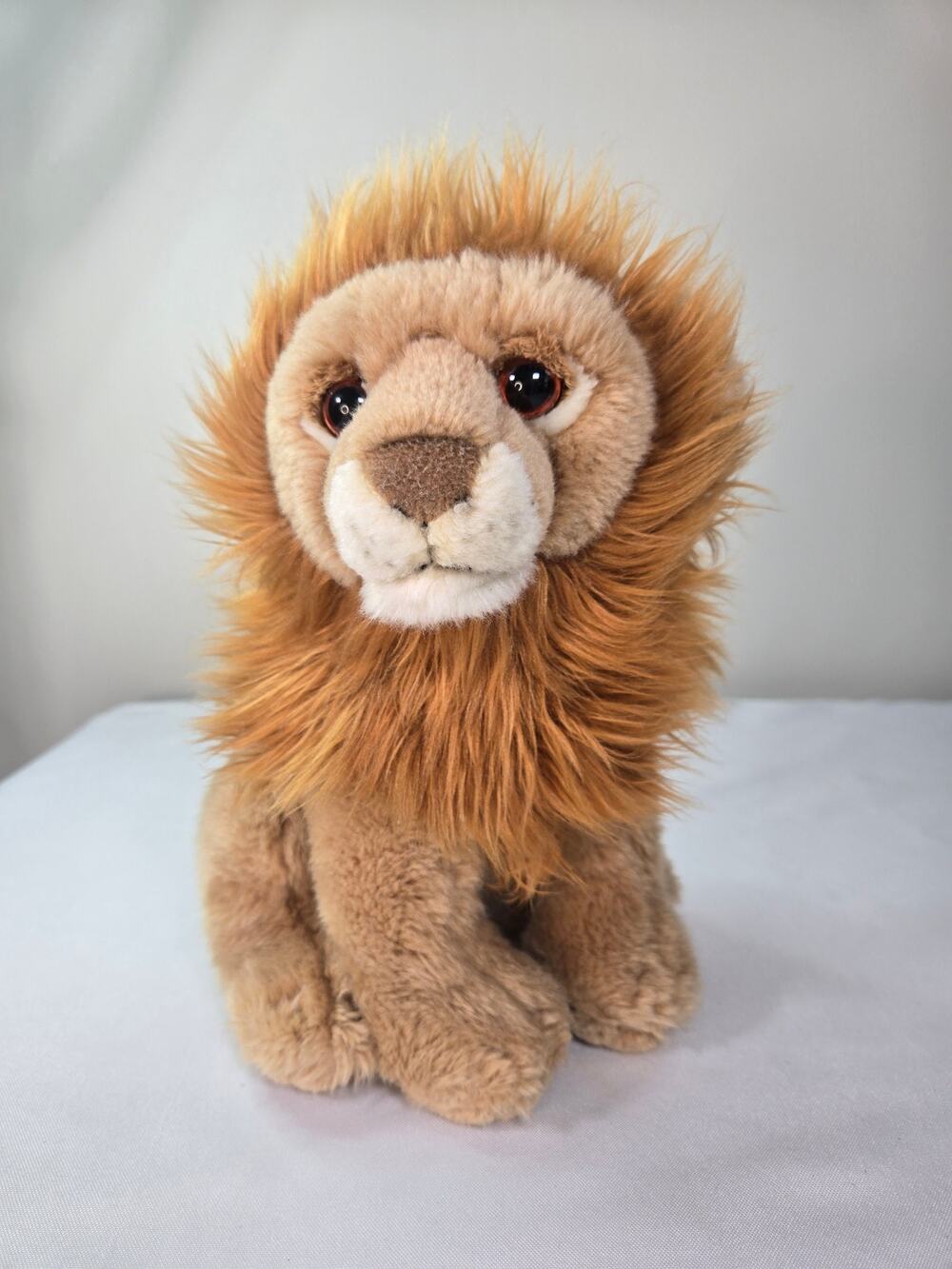 SOS Save Our Lives Plush Lion From The Leasco Collection. 10 Inch X 12 Inch